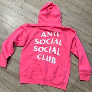 Anti Social Social Club pink and white hoodie.